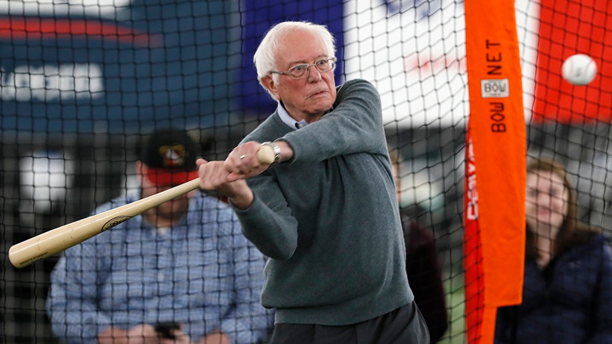 Democratic presidential candidate Sen. Bernie Sanders, I-Vt., hits in the batting cage during a meeting with minor league baseball players and officials at FunCity Turf, Sunday, Dec. 15, 2019, in Burlington, Iowa. (AP Photo/Charlie Neibergall)