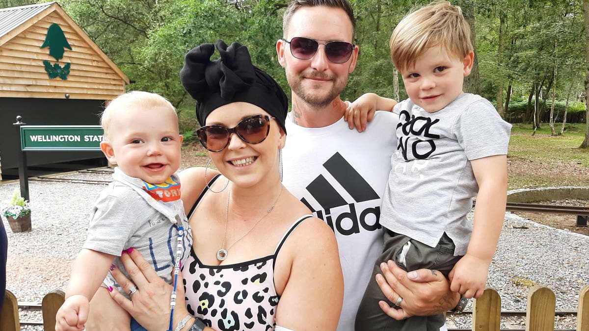 Amy Palmer pictured with her husband Colin and two young children Lenny, now one, and Frankie, 4, first discovered the lump while breastfeeding her son.