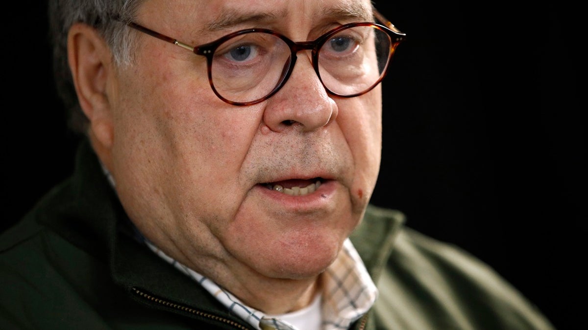 In this Nov. 22, 2019, file photo, Attorney General William Barr speaks with members of the press before participating in a law enforcement roundtable at the Flathead County Sheriff's Posse in Evergreen, Mont. Barr on Monday said he disagreed with a watchdog report on the FBI’s decision to launch the Russia probe. (AP Photo/Patrick Semansky, File)