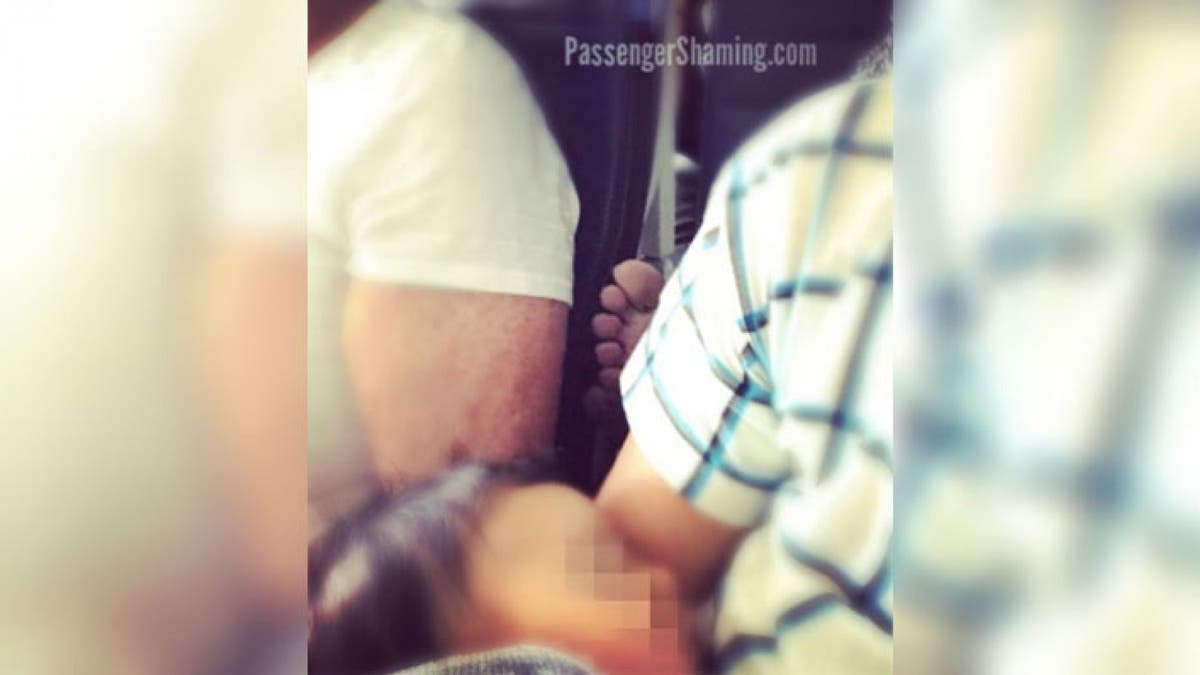 The viral photo shows an unnamed passenger rudely sticking their bare foot somewhere it doesn't belong. (Passengershaming Instagram)