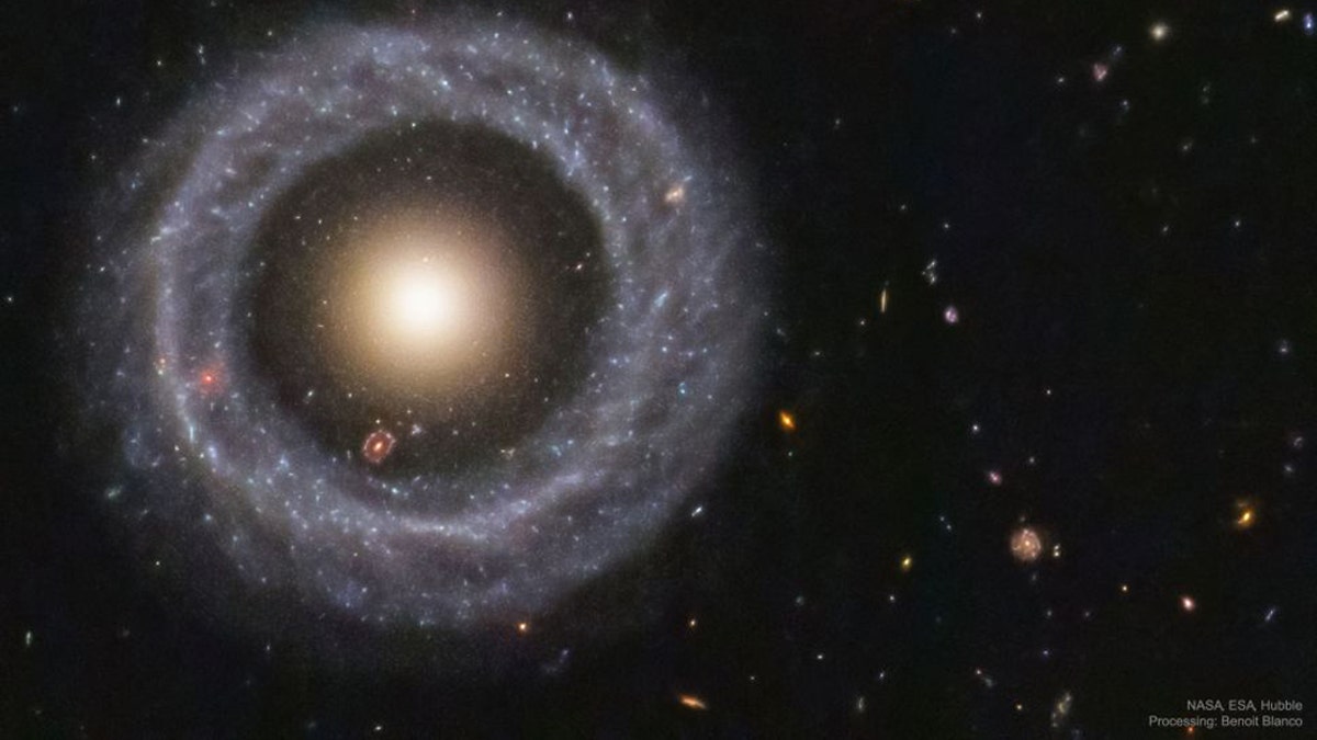 With a perfectly symmetrical ring circling a red sphere of stars, Hoag's object is one of the prettiest mysteries in the universe. (Credit: NASA/ESA/Hubble)