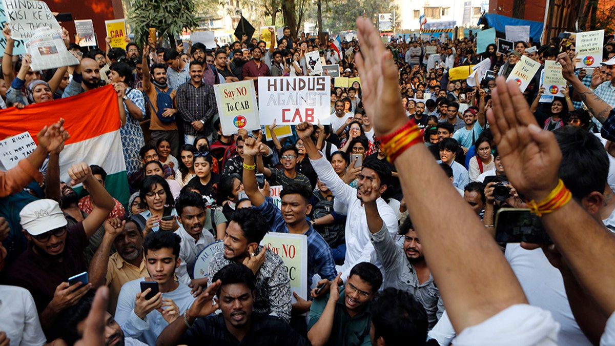 Indians protest against a new citizenship law in Mumbai, India, Monday, Dec. 16, 2019. The new law gives citizenship to non-Muslims who entered India illegally to flee religious persecution in several neighboring countries.
