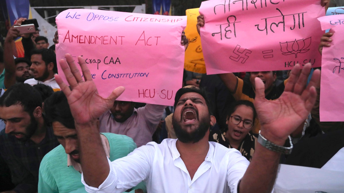 Indian Hyderabad Central University (HCU) students shout slogans during a protest rally against a new citizenship law in Hyderabad, India, Monday, Dec.16, 2019. The new law gives citizenship to non-Muslims who entered India illegally to flee religious persecution in several neighboring countries. (AP Photo/Mahesh Kumar A.)