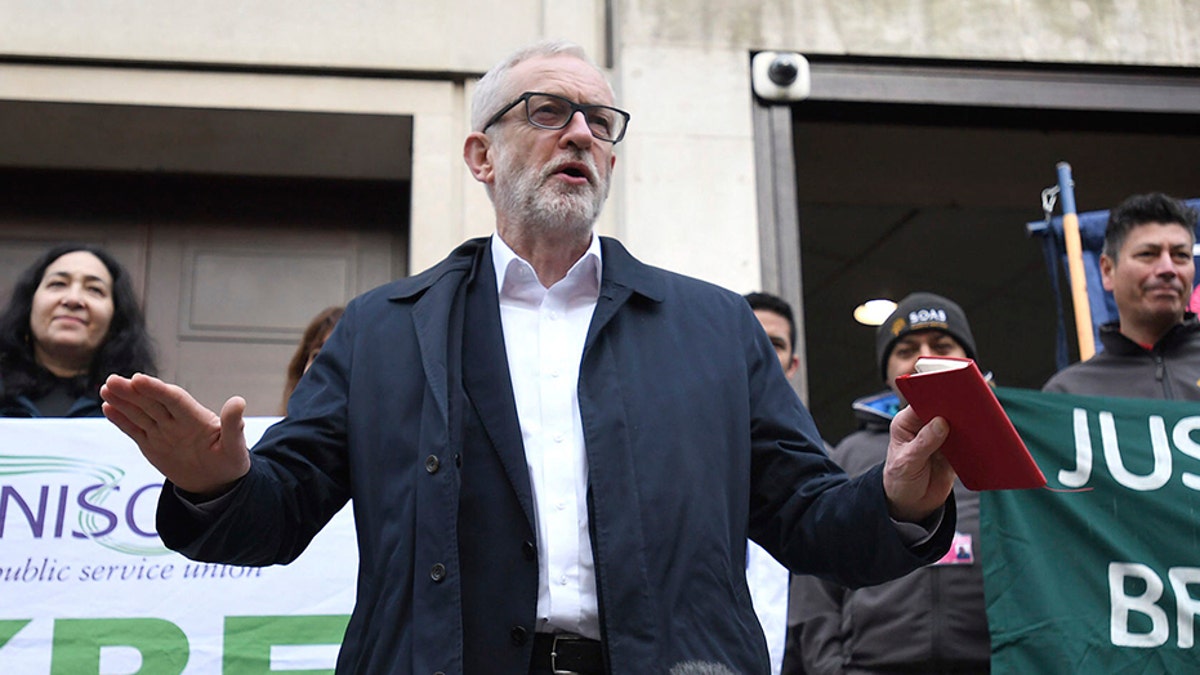 Labour leader Jeremy Corbyn speaks outside Birkbeck/SOAS University of London as he announces his party's plan Tuesday for the extension of workers' rights.