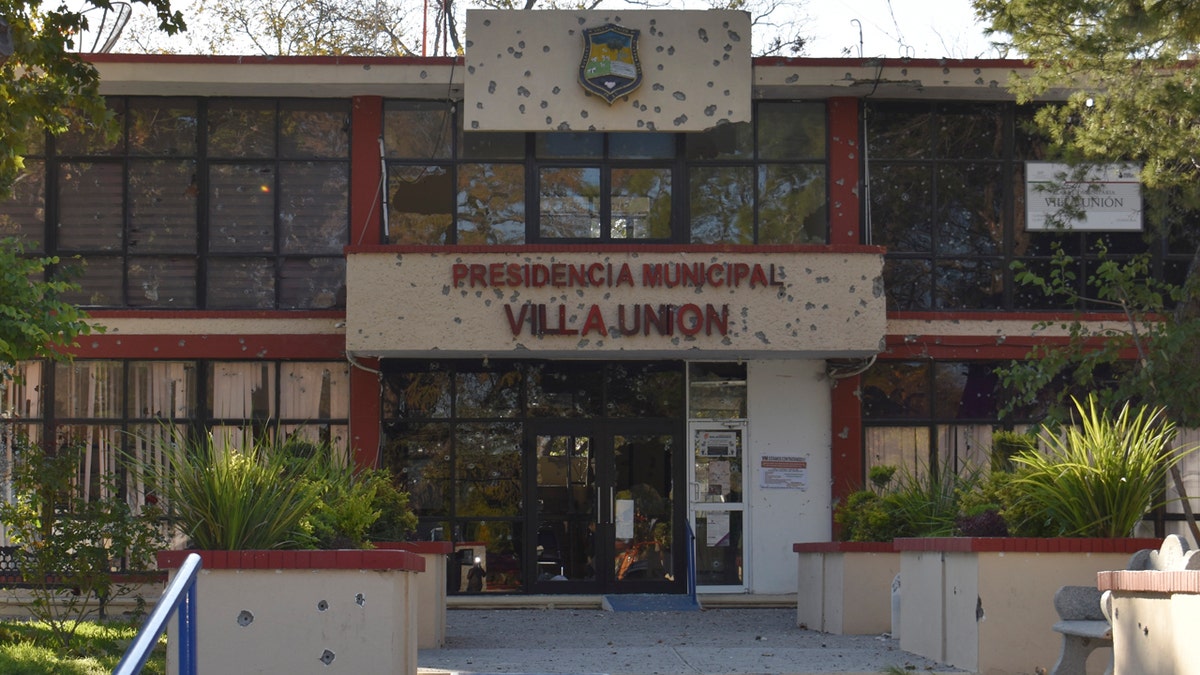 The City Hall of Villa Union is riddled with bullet holes after a gun battle between Mexican security forces and suspected cartel gunmen, Saturday, Nov. 30, 2019.