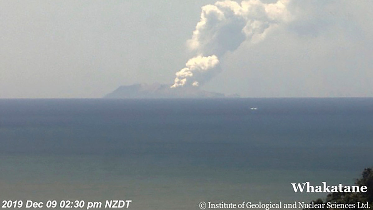 This image released by GNS Science, shows plumes of smoke from a volcanic eruption on White Island, seen from Whakatane, New Zealand Monday, Dec. 9, 2019.