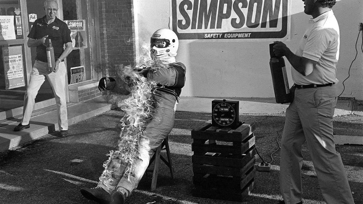 Simpson demonstrated the fire resistance of his latest racing suit at the1986 Indianapolis 500.