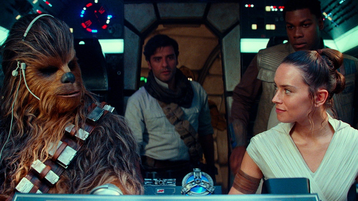 This image released by Disney/Lucasfilm shows, from left, Joonas Suotamo as Chewbacca, Oscar Isaac as Poe Dameron, Daisy Ridley as Rey and John Boyega as Finn in a scene from "Star Wars: The Rise of Skywalker."