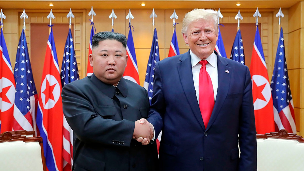 Trump shaking Kim Jong Un's hand