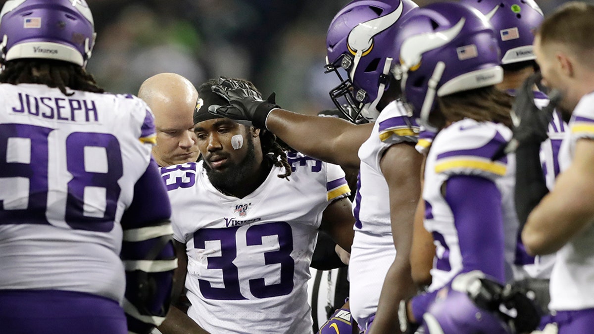 Minnesota Vikings's Dalvin Cook (33) heads off the field after being injured during the second half of an NFL football game against the Seattle Seahawks, Monday, Dec. 2, 2019, in Seattle.