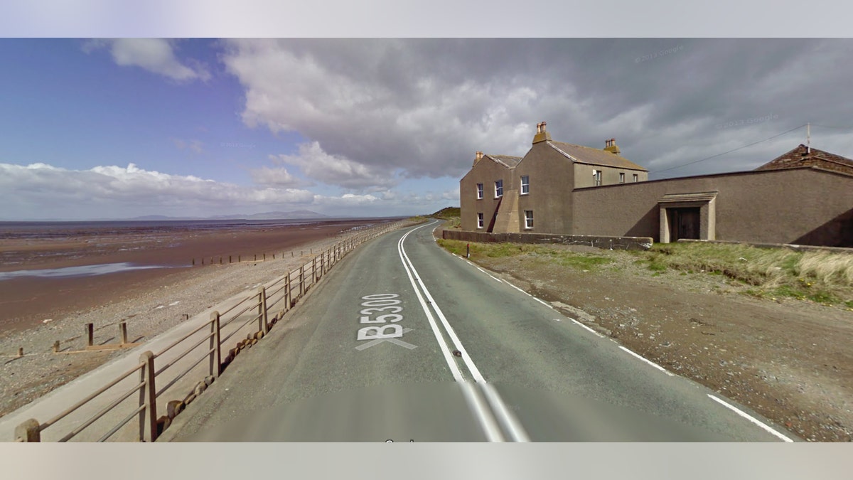 The waterline is far from the road at low tide.