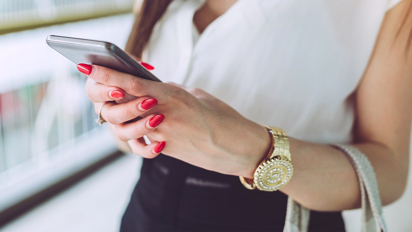 woman texting phone istock