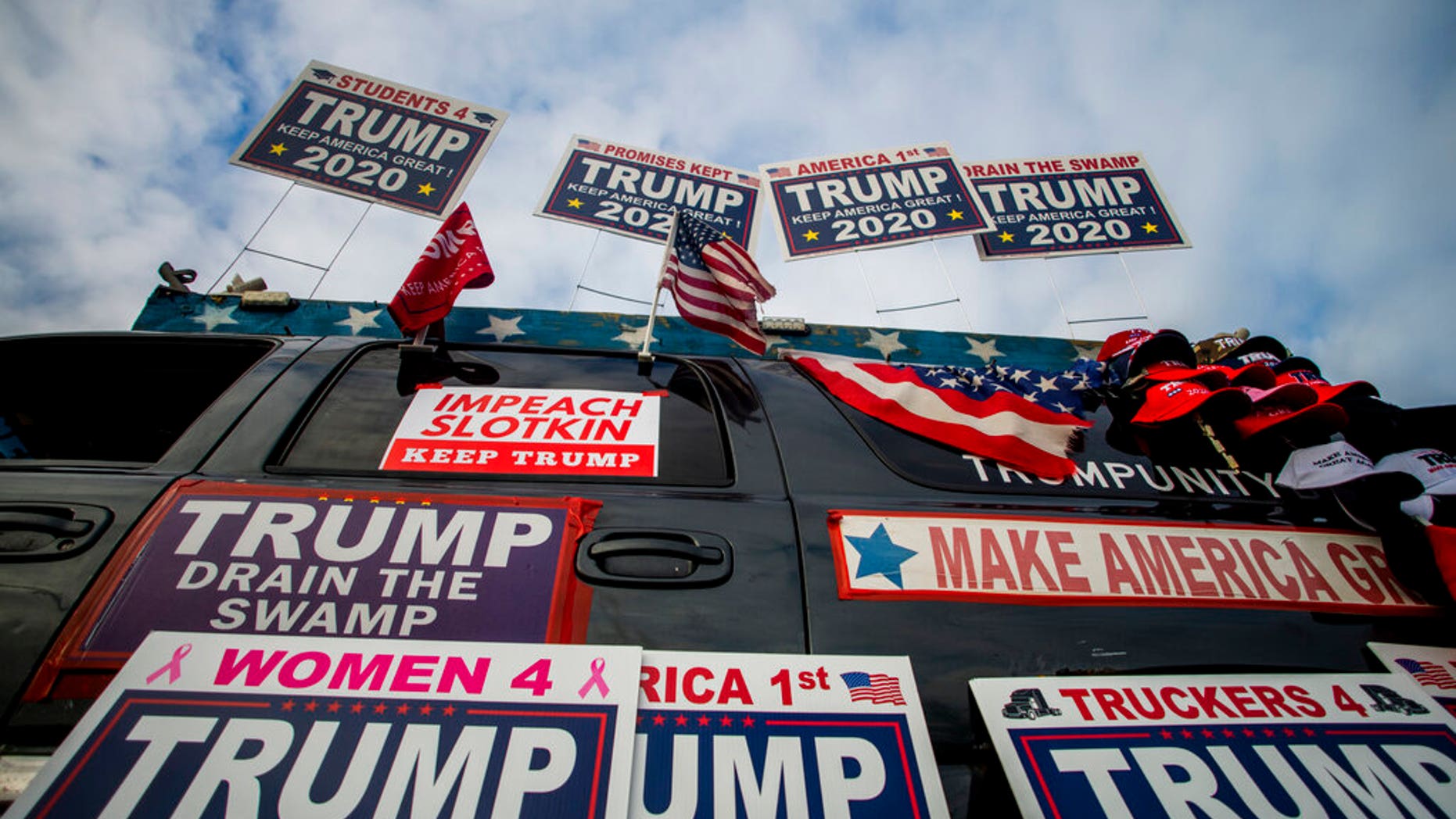 Trump supporters protest outside a town hall meeting where U.S. Rep. Elissa Slotkin (D-Mich.) is speaking on Monday, Dec. 16, 2019, in the Oakland Center at Oakland University in Rochester, Mich. (Jake May/The Flint Journal via AP)