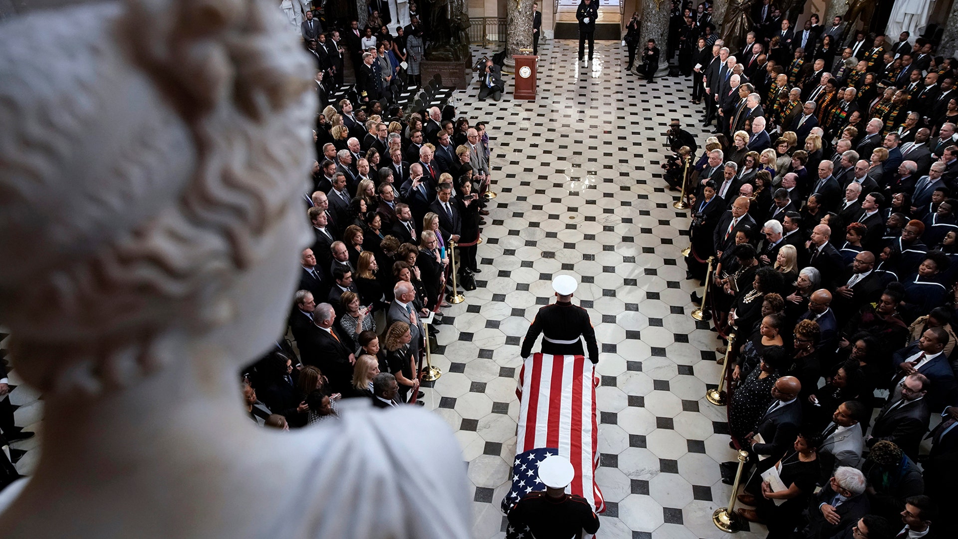 A military honor guard moves the casket of Rep. Elijah Cummings into Statuary Hall at the U.S. Capitol in Washington, Oct. 24, 2019.
