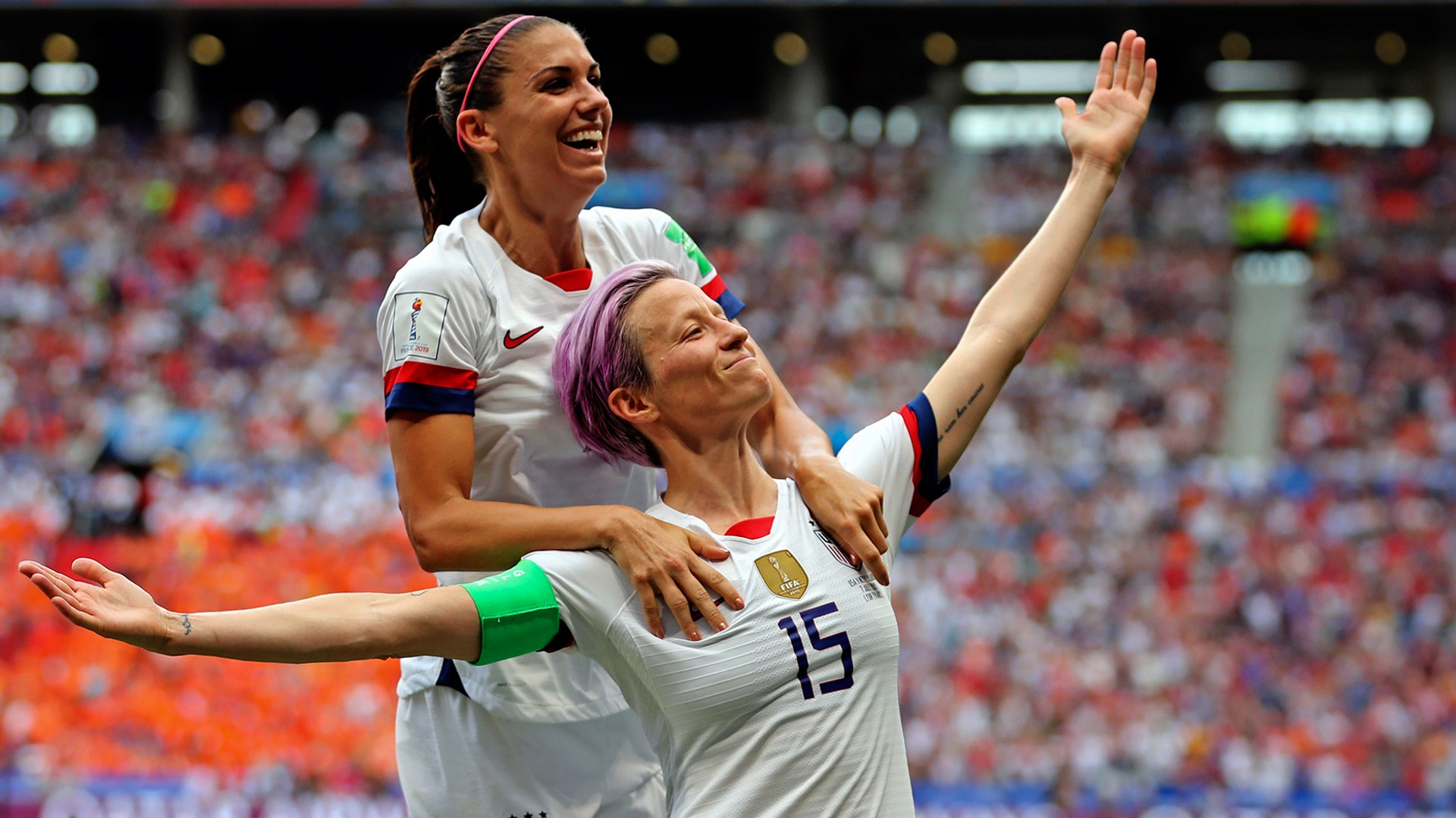 United States' Megan Rapinoe celebrates with teammate Alex Morgan after Rapinoe scored the opening goal during the Women's World Cup final soccer match between the U.S. and The Netherlands in Lyon, France, July 7, 2019. 