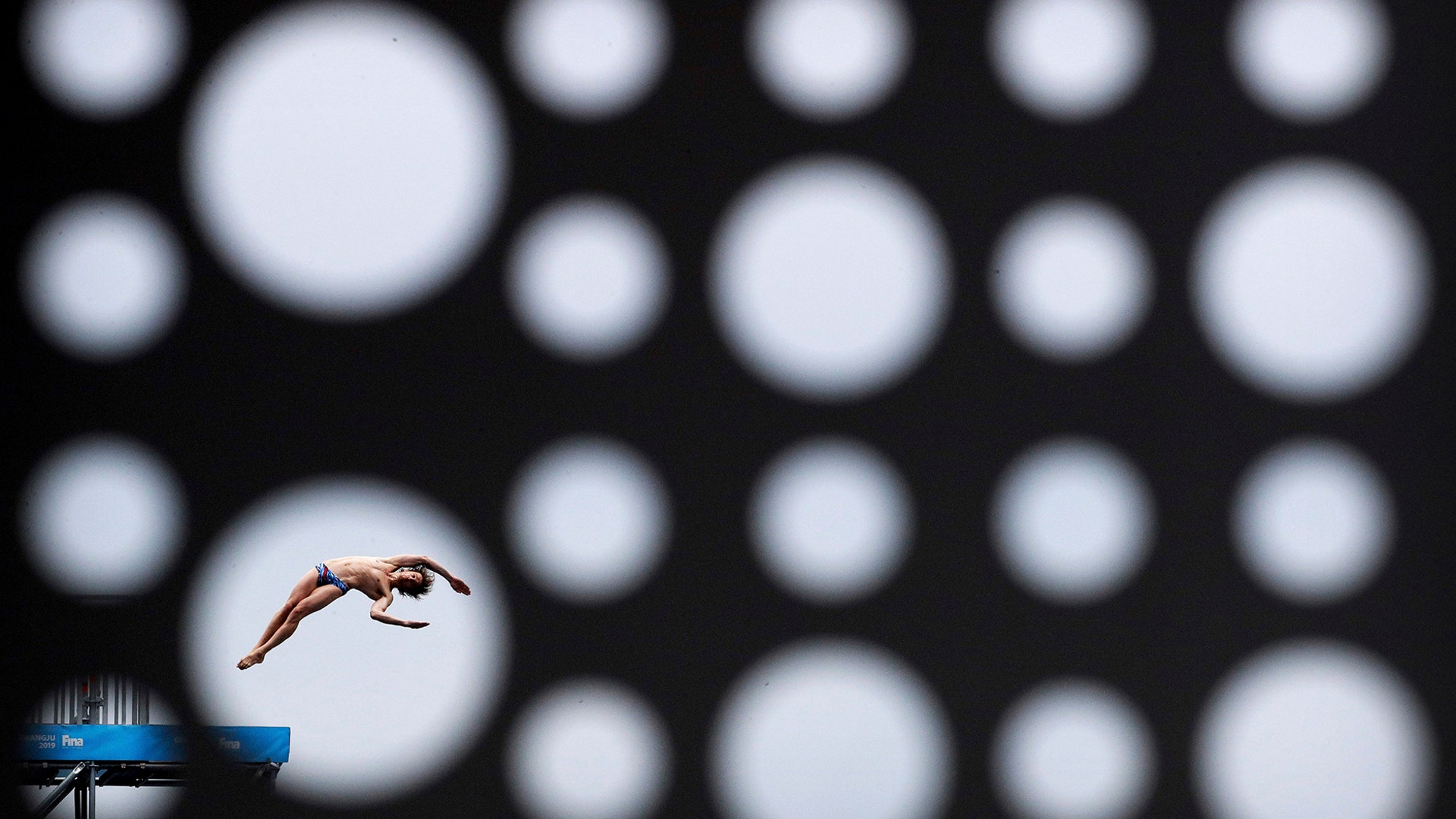 Gold medalist Gary Hunt of Britain performs a dive during the men's high diving competition at the World Swimming Championships in Gwangju, South Korea, July 24, 2019. 