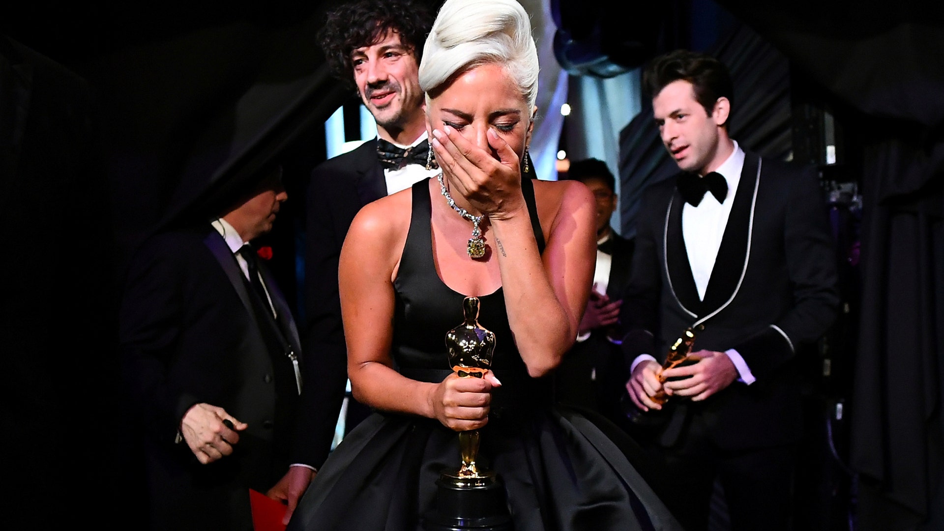 Lady Gaga reacts after winning the Oscar for Best Original Song, "Shallow" at the Academy Awards in Hollywood, February 24, 2019.
