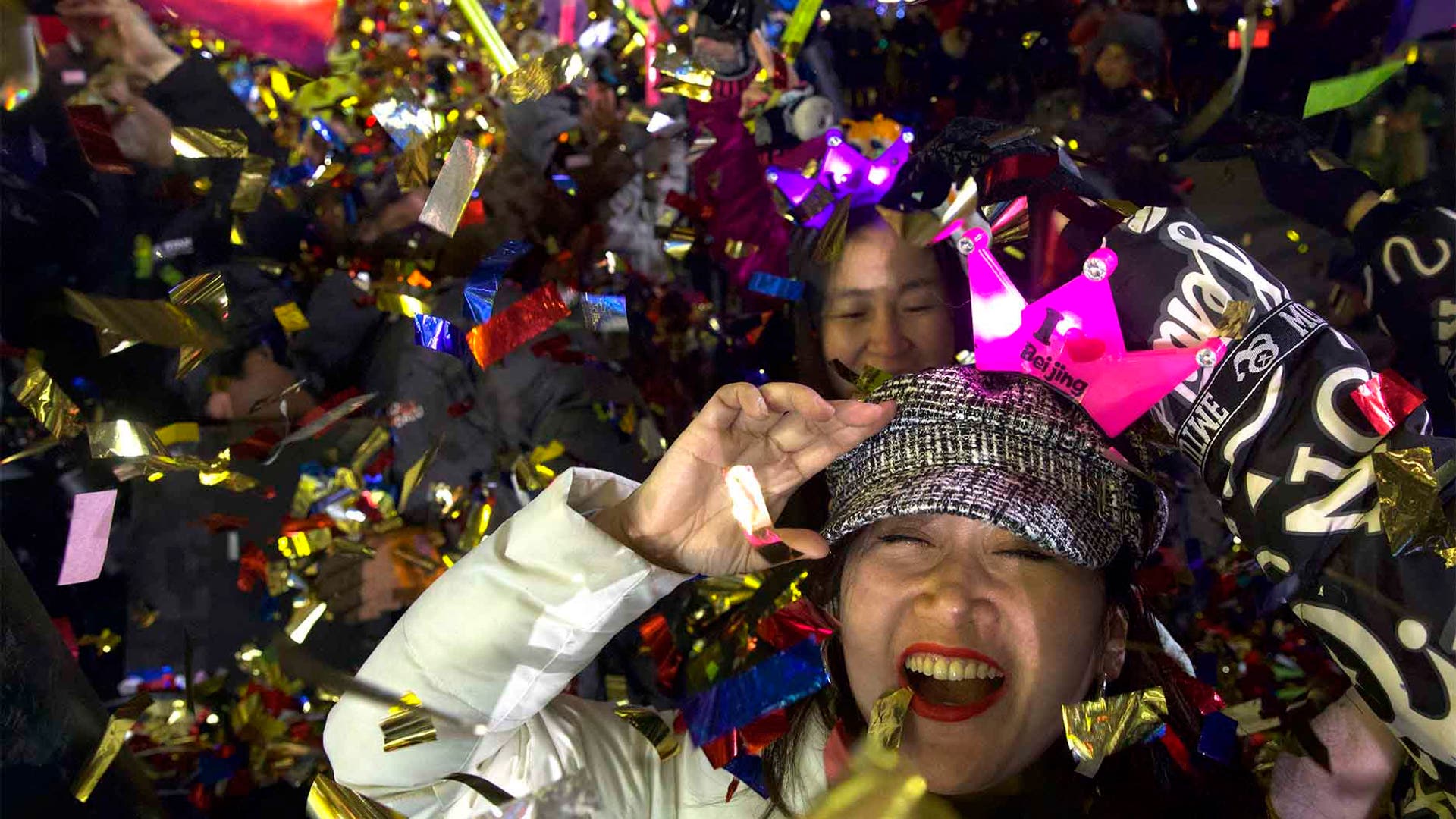 Beijing, China: People celebrate the arrival of the year 2020 at a New Year's Eve countdown near the 2022 Bejing Winter Olympic headquarters. (AP Photo/Ng Han Guan)