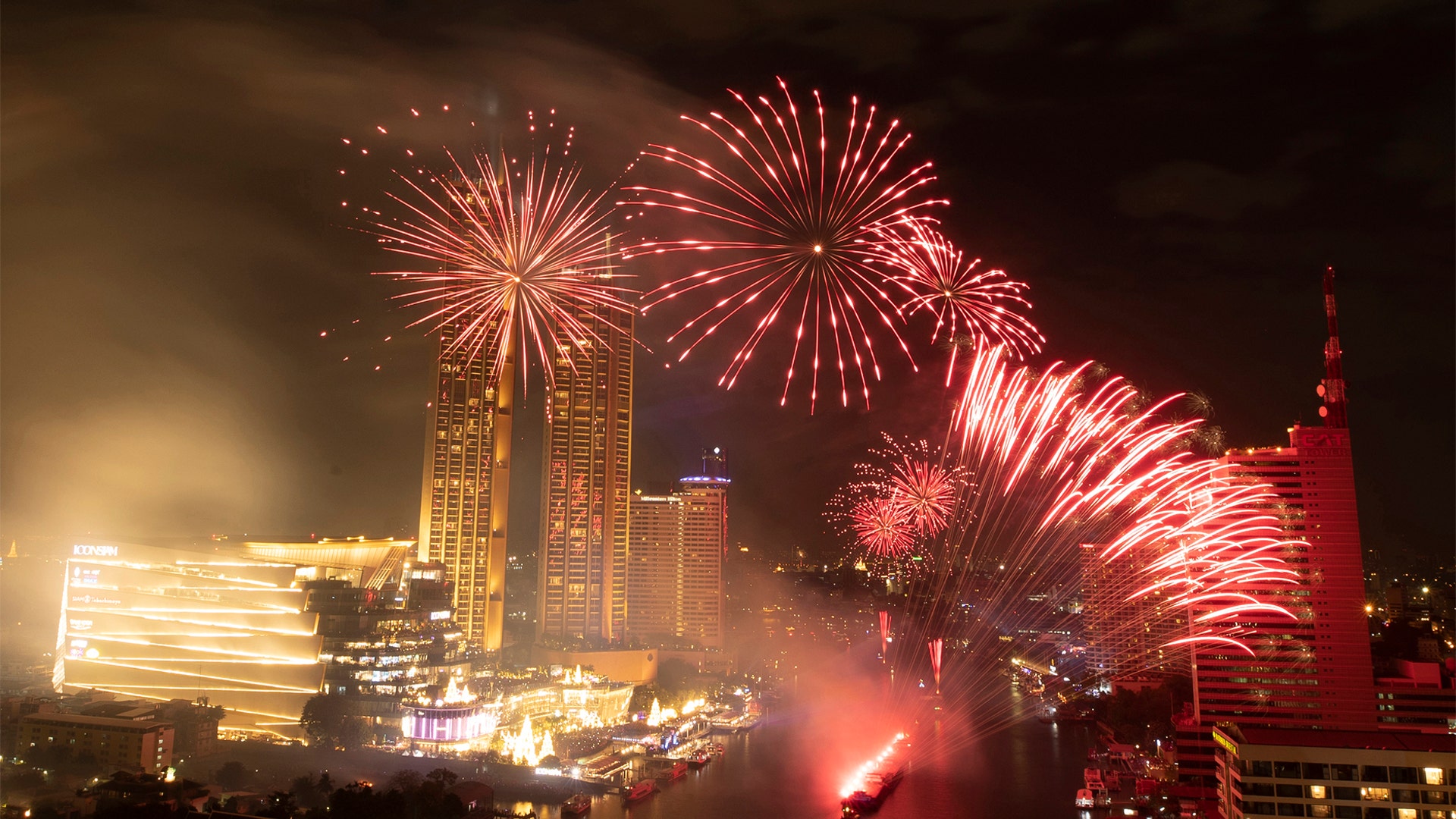 Bangkok, Thailand: Fireworks explode over the Chao Phraya River during New Year celebrations. (AP Photo/Sakchai Lalit)