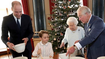 Queen Elizabeth is joined by Princes George, William and Charles to make Christmas desserts