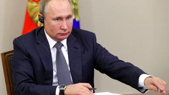 Putin signs bills mandating Russian apps on electronic devices, targeting journalists  
