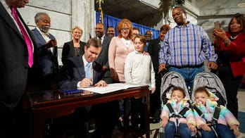 Kentucky's Beshear restores voting rights to over 100,000 convicted felons days after inauguration
