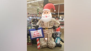 Group condemns 'soldier Santa' holding 'God bless America' sign at Army base