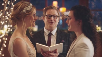 Hallmark to reinstate Zola commercial showing brides kissing, after backlash
