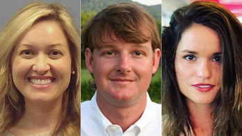 Georgia county commissioner's wife dumps cup of soda on reporter's head at public meeting