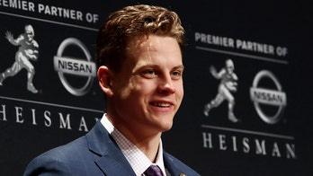 LSU Tigers' Joe Burrow thanks coach Ed Orgeron in emotional speech after winning Heisman Trophy