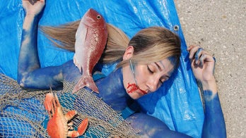 PETA activists don body paint, impersonate dead fish to protest holiday seafood sale