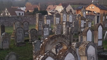 Macron vows to fight hate ‘until our dead can sleep in peace’ after Jewish graves appear defaced with swastikas