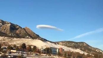 Lenticular cloud hovers in Colorado sky over mountain like a 'flying saucer'