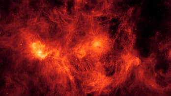NASA's Spitzer Telescope captures massive 'burning' cloud in space