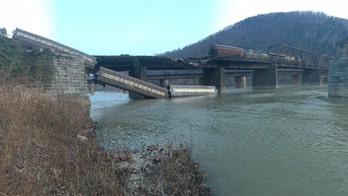 Freight train cars derail into the Potomac River near Harpers Ferry in West Virginia