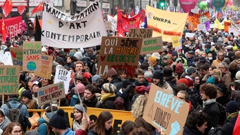 Fires erupt in Paris as general strike creates travel nightmare, closing the Eiffel Tower and subway stations