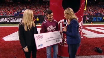 College football halftime winner shares gospel after winning $100G in tuition