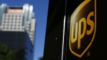 New York UPS driver protects boy's Christmas toy by hiding it behind trash bins, video shows