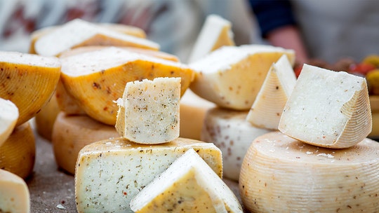 Woman fed up with nearby cheese shop's alleged stench told to stop covering neighborhood in disparaging signs