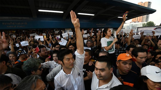 Thai protesters give three-finger 'Hunger Games' salute as thousands join largest demonstration in years