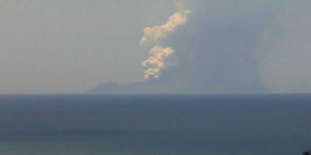 This image released by GNS Science, shows plumes of smoke from a volcanic eruption on White Island, seen from Whakatane, New Zealand Monday, Dec. 9, 2019. A volcano erupted Monday on a small New Zealand island frequented by tourists, and a number of people were missing and injured after the eruption. (GNS Science via AP)