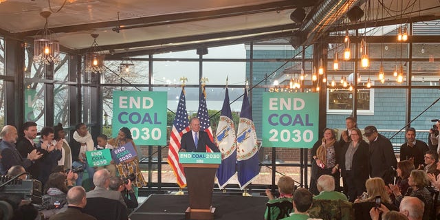 Democratic presidential candidate Mike Bloomberg unveils his plans to combat climate change at a campaign event in Alexandria, Virginia on Dec. 13, 2019