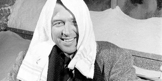 Actor Jimmy Stewart smiling during a break in filming on the set of the movie