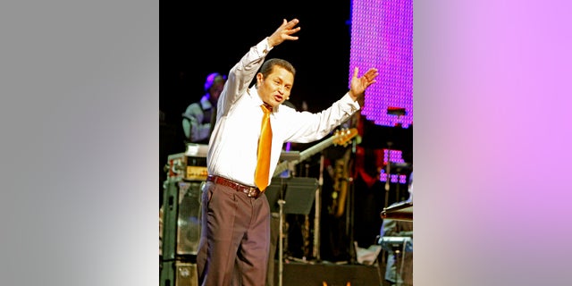 Guillermo Maldonado, pastor of King Jesus International Ministry Church, speaks to the crowd, Friday, Oct. 9, 2009 in Miami. Maldonado will host President Donald Trump at a rally this week. He is guaranteeing that parishioners who entered the U.S. illegally won't risk deportation by attending. (Charles Trainor Jr./The Miami Herald via AP)