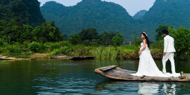 Actors stage a wedding on the Li River, in the Guangxi Province of China.