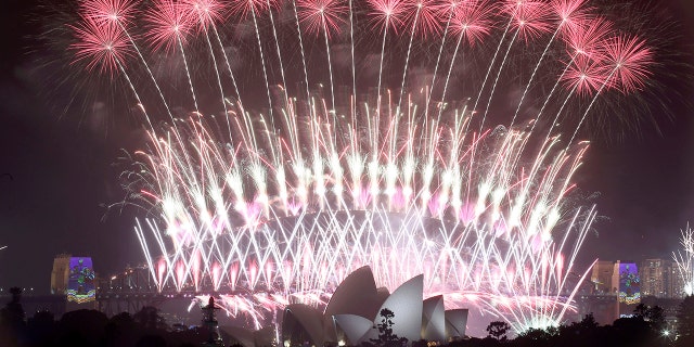 FILE - In this Jan. 1, 2017, file photo, fireworks explode over the Sydney Opera House and Harbour Bridge as New Year's celebrations are underway in Sydney. Australia's Prime Minister Scott Morrison says Sunday, Dec. 29, 2019, Sydney's iconic New Year's Eve fireworks will go ahead despite the wildfire crisis to show the world "Australia’s resiliency.“ Authorities meanwhile braced for conditions to deteriorate with high temperatures. (AP Photo/Rick Rycroft, File)