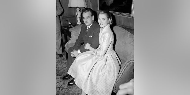In this Jan. 5, 1956 file photo, actress Grace Kelly and Prince Rainier III of Monaco, sit arm-in-arm as they meet the press in Philadelphia.
