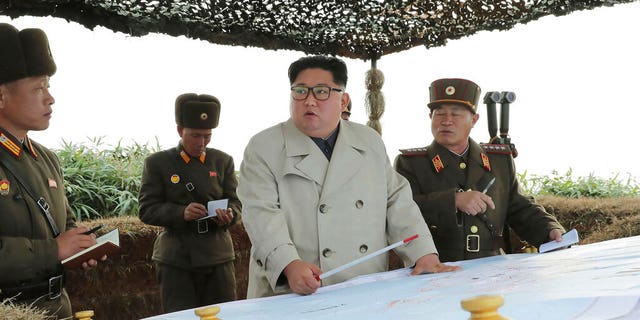 North Korean leader Kim Jong Un, center, inspects a military unit on Changrin Islet in North Korea.