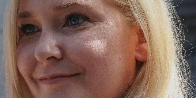 In this Aug. 27, 2019, photo, Virginia Roberts Giuffre, who says she was trafficked by sex offender Jeffrey Epstein, holds a news conference outside a Manhattan court where sexual assault claimants invited by a judge addressed a hearing following Epstein's jailhouse death in New York. Prince Andrew suffered fresh scrutiny Monday night, Dec. 2, when Giuffre, who told BBC she was a trafficking victim made to have sex with him when she was 17, asked the British public to support her quest for justice.