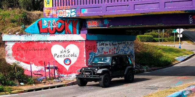 A tribute to victims of the Naval Air Station Pensacola shooting that was freshly painted on what’s known as Graffiti Bridge in downtown Pensacola, Fla.